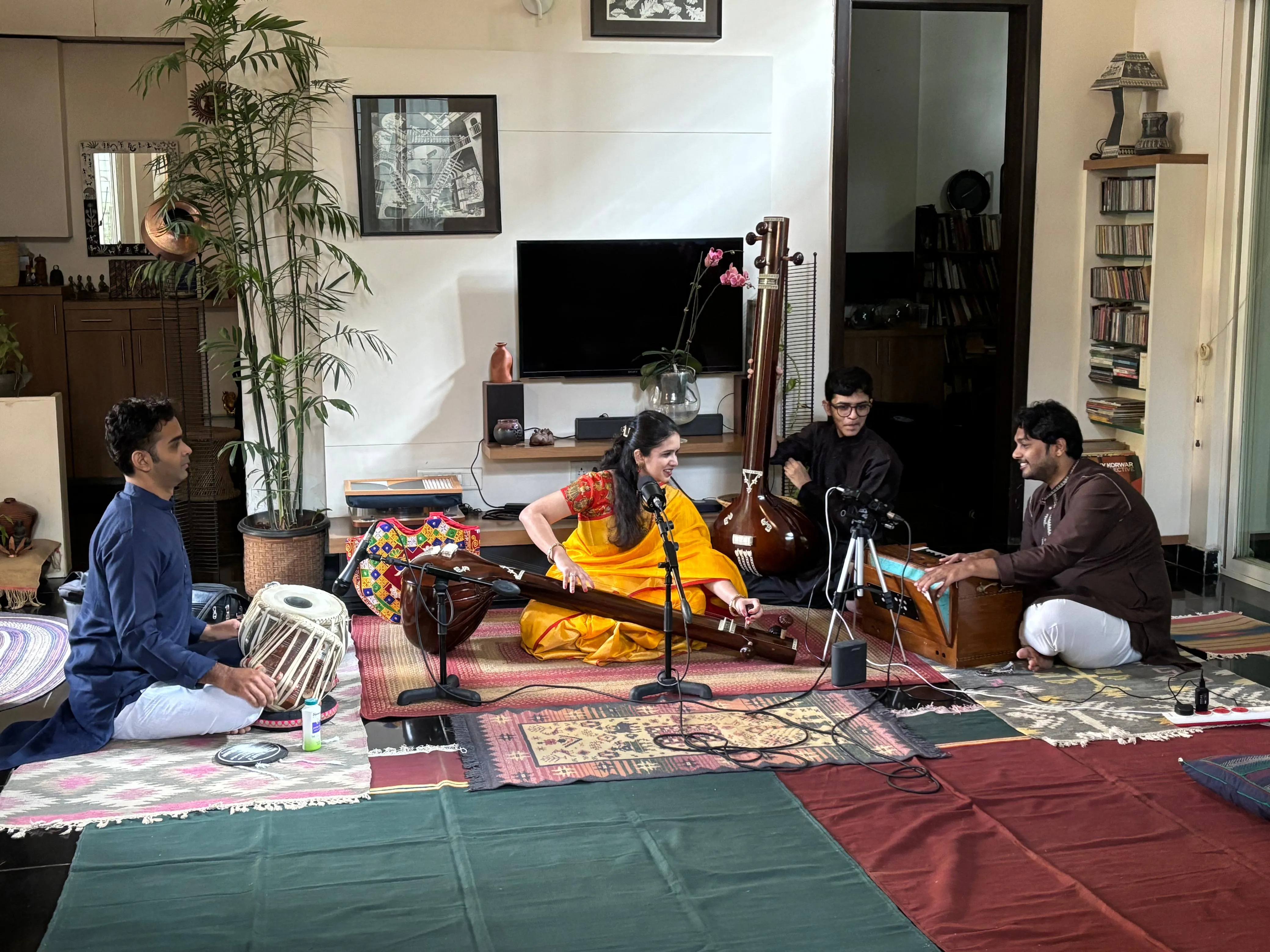Devashree Nawghare preparing to tune Tanpura.Cj3j0rQ0